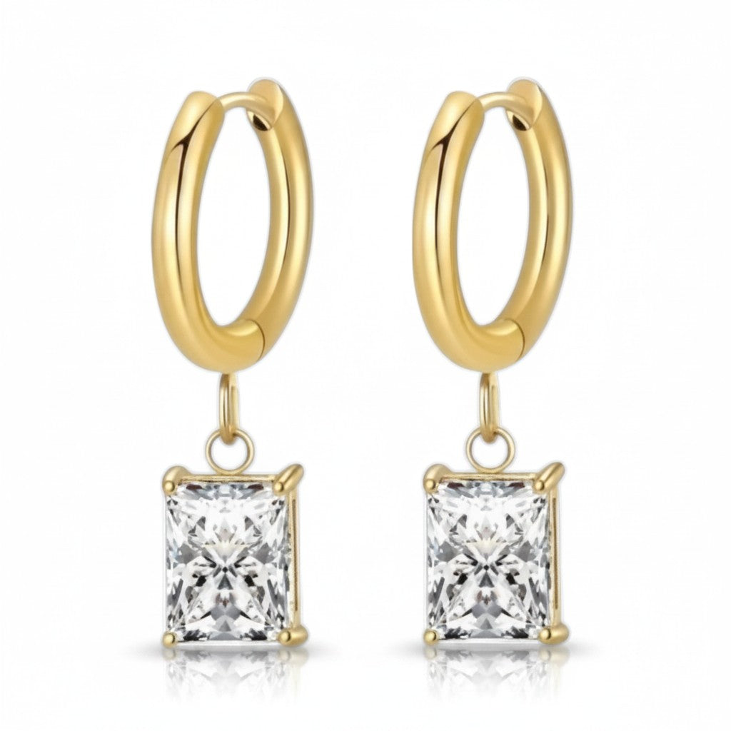 Gold hoop earrings with square-cut gemstones on a white background