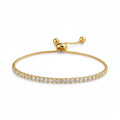 Gold bracelet with diamond accents on a white background