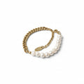 Gold chain bracelet with white pearls on a white background