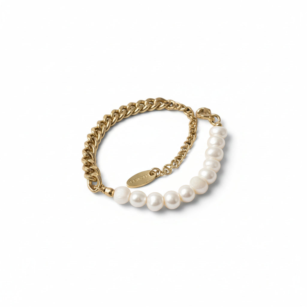 Gold chain bracelet with white pearls on a white background